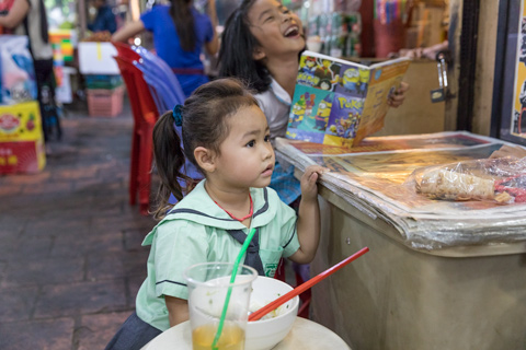 children at market phnom penh cambodia