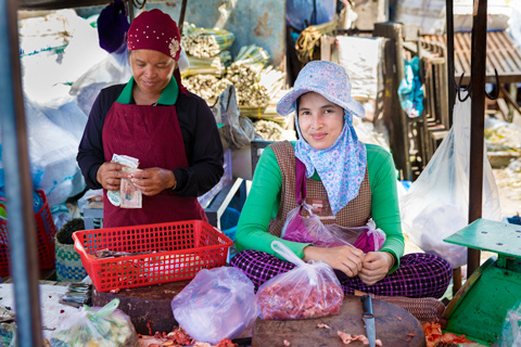 Two women selling meat in market Phnom Penh